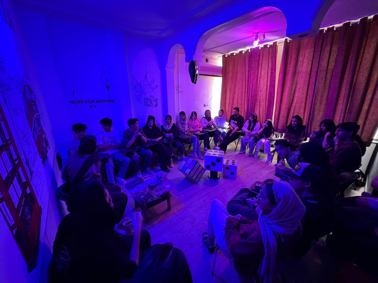 Teacher leading a small classroom discussion
